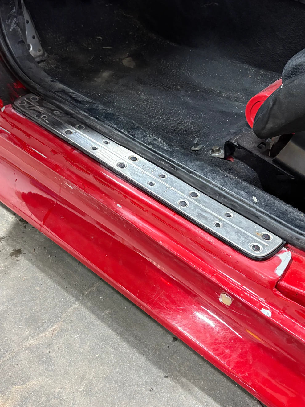 Dunlap Aero Solutions side skirt mounting brackets for Lexus IS300 assembled and shown from alternate angle highlighting bracket alignment and mounting structure