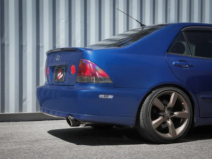 aFe Takeda cat back exhaust system installed on Lexus IS300 2001-2005 with carbon fiber tip on-car rear view showing fitment and exhaust exit