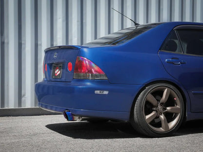 aFe Takeda cat back exhaust system installed on Lexus IS300 2001-2005 with titanium blue tip on-car rear view showing fitment and exhaust exit