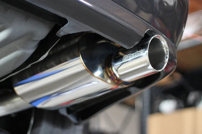 Extreme close-up of the laser-etched GReddy logo on the Supreme SP V2 exhaust tip for a Lexus IS300, showing the high-precision finish