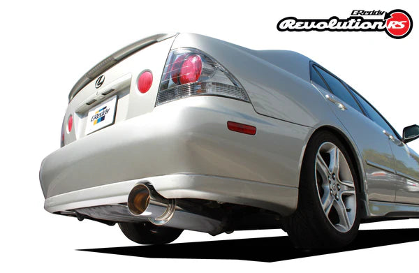 Rear view of a Lexus IS300 featuring the GReddy Revolution RS exhaust with a large 3-inch polished muffler and straight-exit design