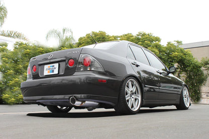 Rear view of a Lexus IS300 equipped with the GReddy Supreme SP V2 catback exhaust, showing the updated oval muffler design and polished tip