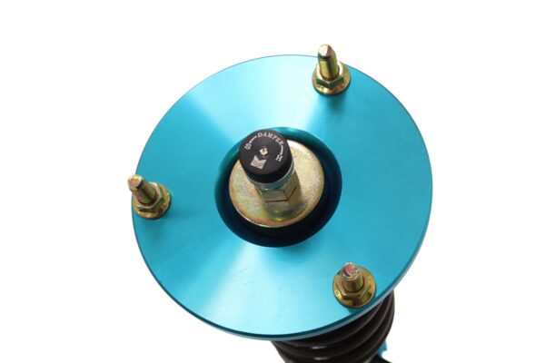 Close-up of the Megan Racing EZII top mounts for IS300 showing the 15-way dampening adjustment knob