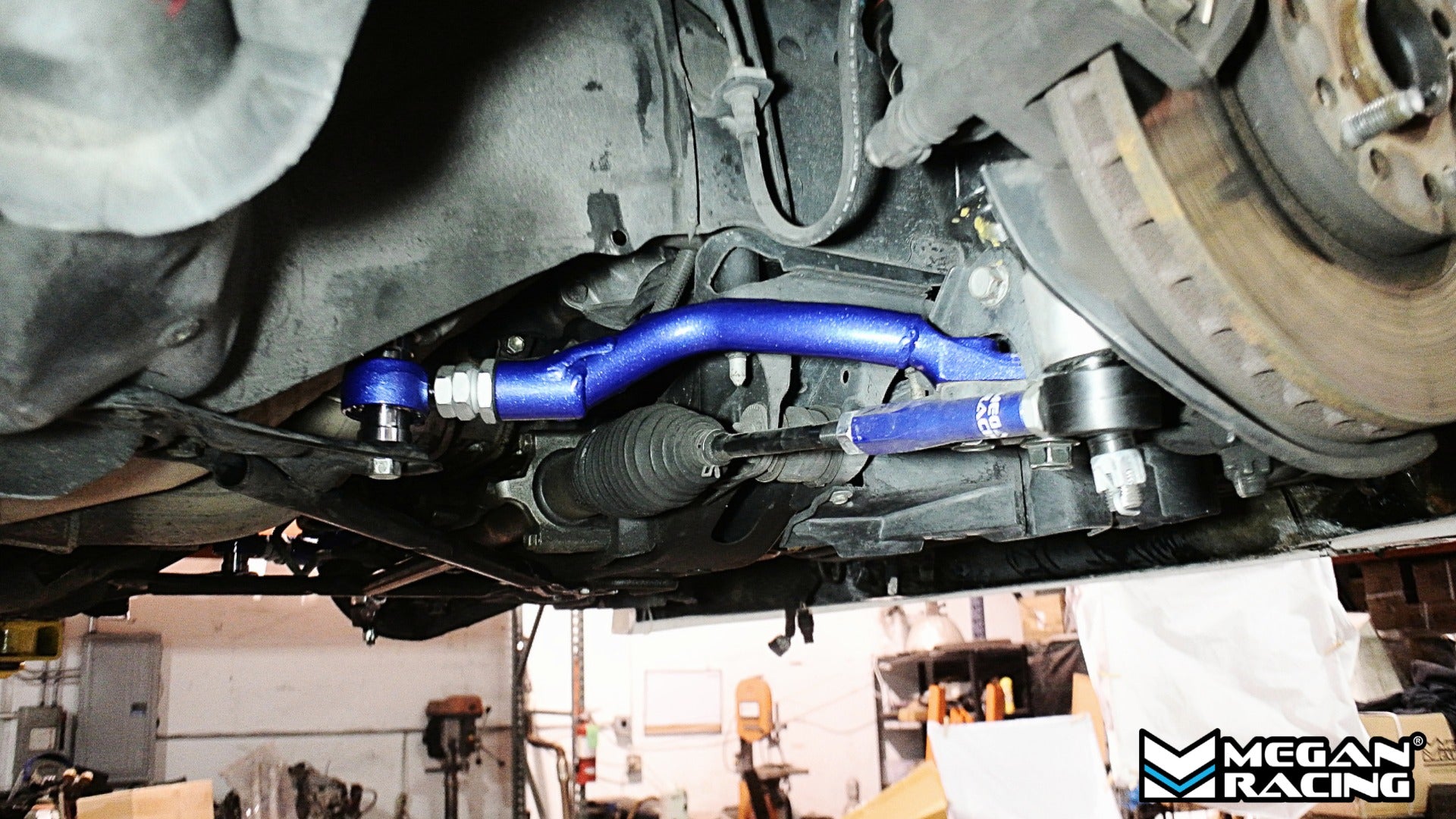 Megan Racing front tension rod installed on Lexus IS300 2001-2005 on-car view showing suspension fitment and mounting position